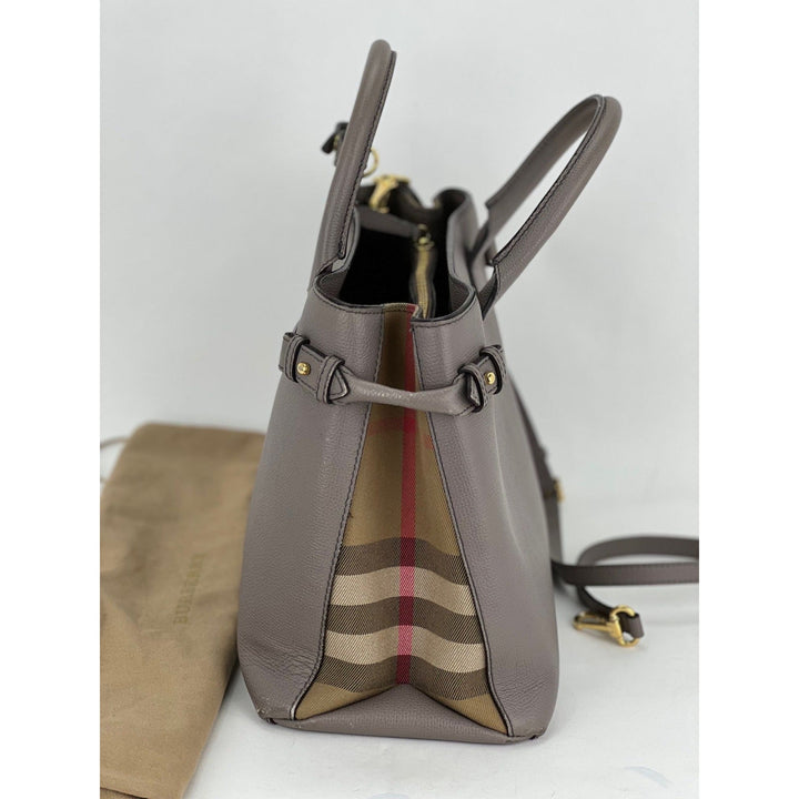 Gray handbag with a visible brand logo on a white background