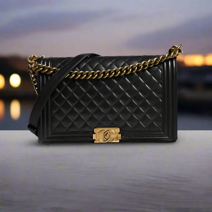 Preloved CHANEL classic quilted handbag front view Authentic CHANEL black leather flap bag CHANEL gold chain shoulder bag – preloved Vintage CHANEL logo clutch purse Secondhand CHANEL luxury tote with dust bag