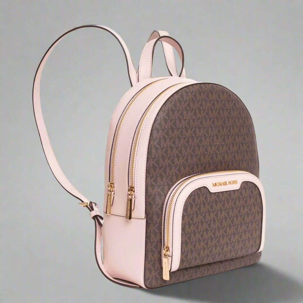 Brown and beige backpack with gold accents on a white background
