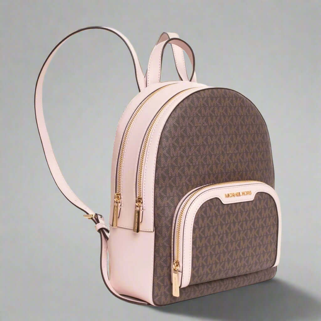 Brown and beige backpack with gold accents on a white background