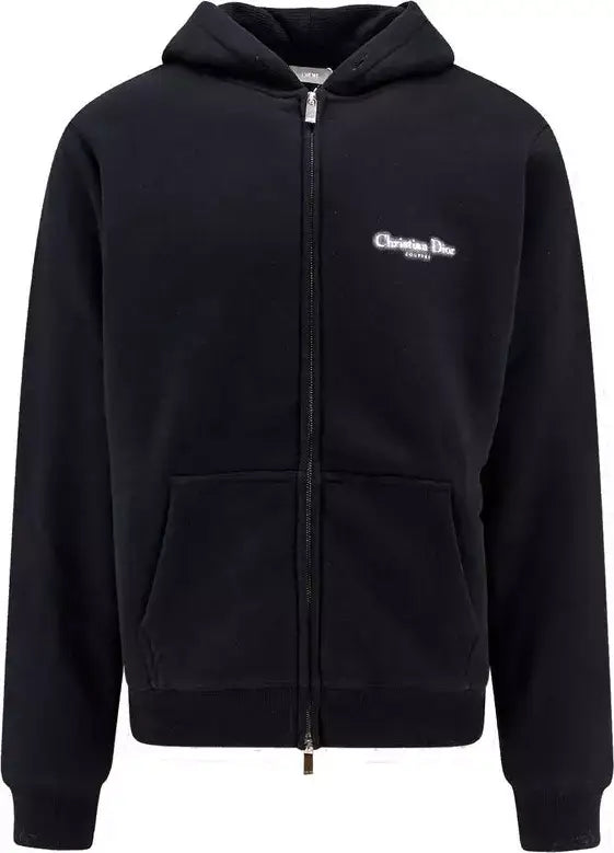 Black hoodie with a small logo on the chest against a white background