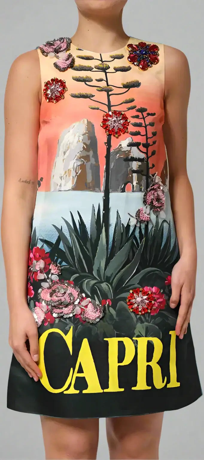Dress with floral and rock design and 'Capri' text on a white background