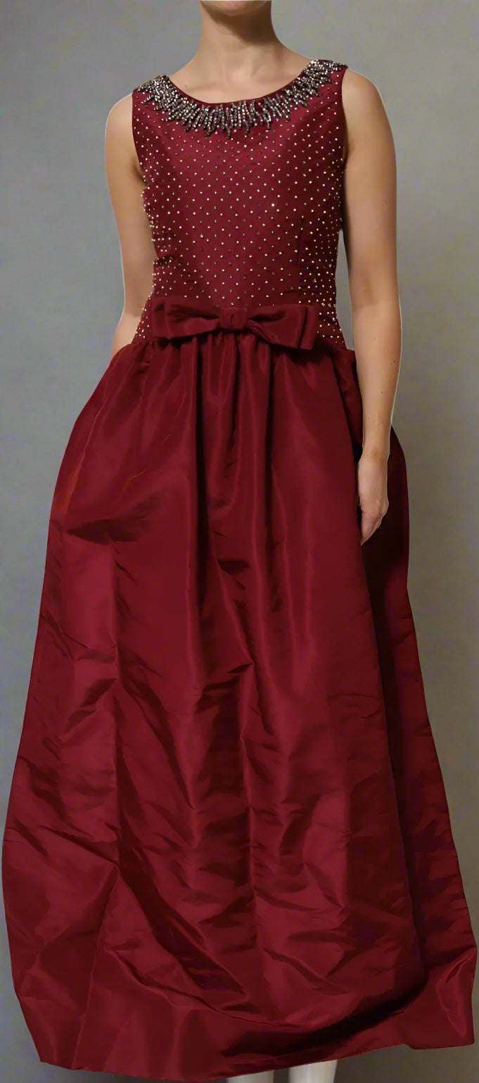 Maroon evening gown with beaded top on a white background