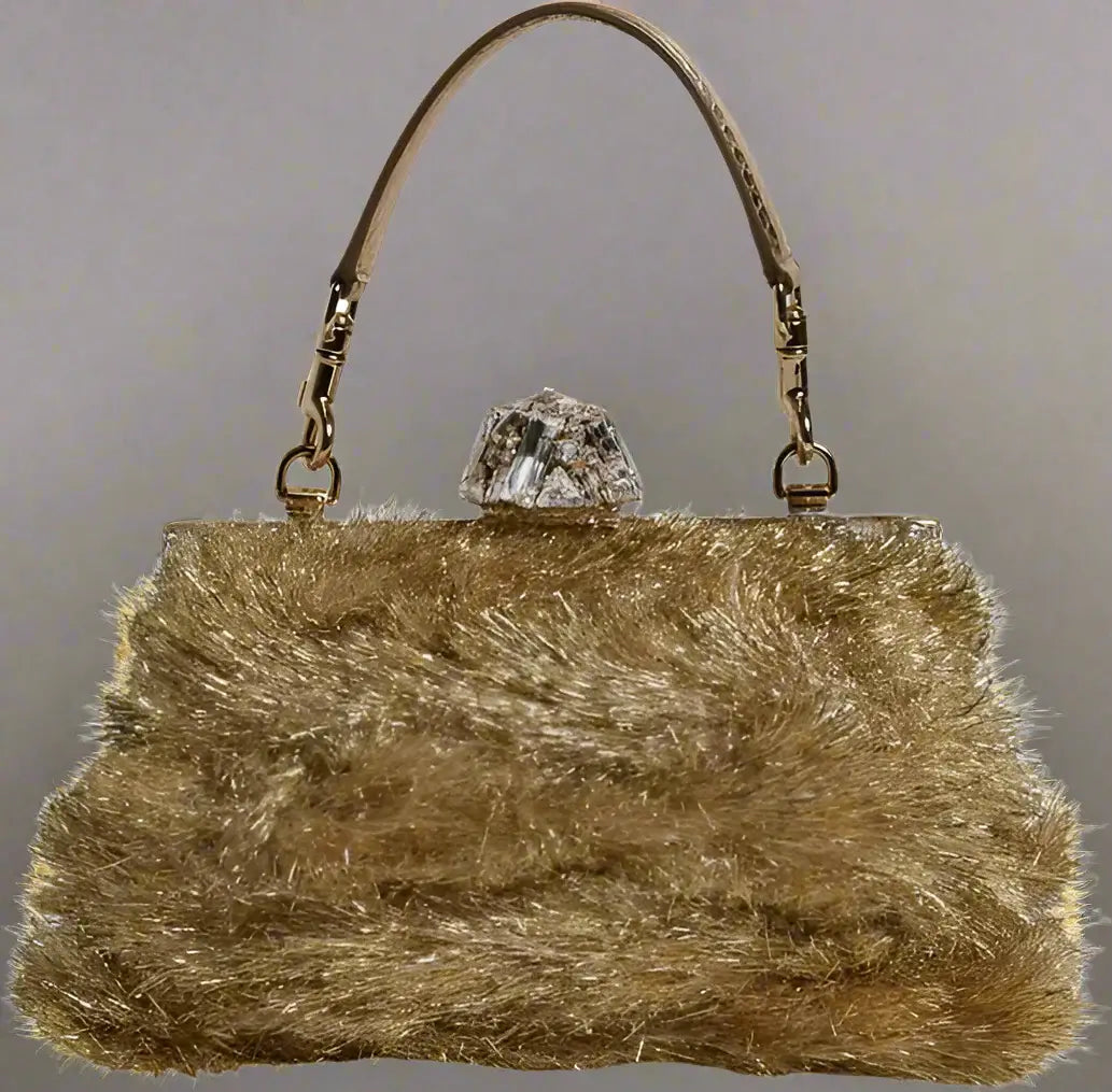 Gold fluffy handbag with a crystal clasp on a white background