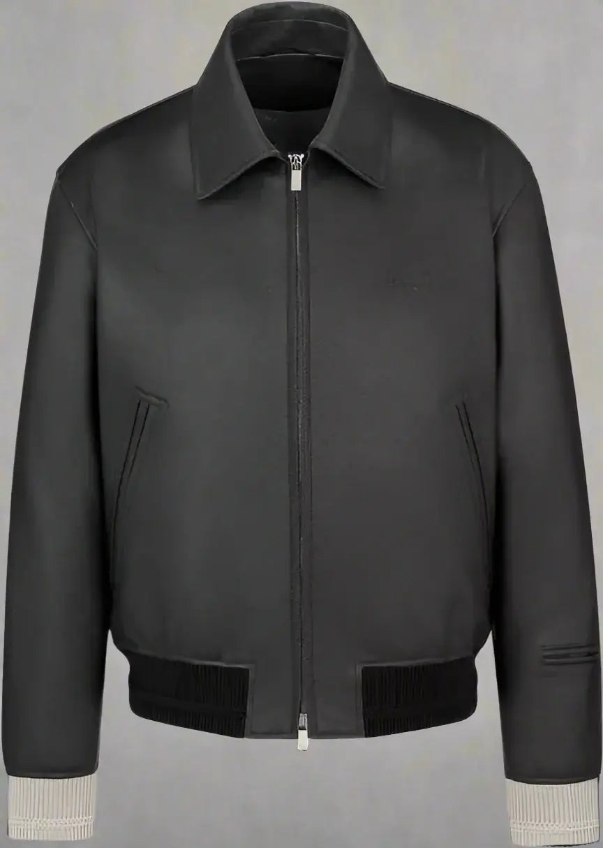 Black leather jacket with beige cuffs on a white background