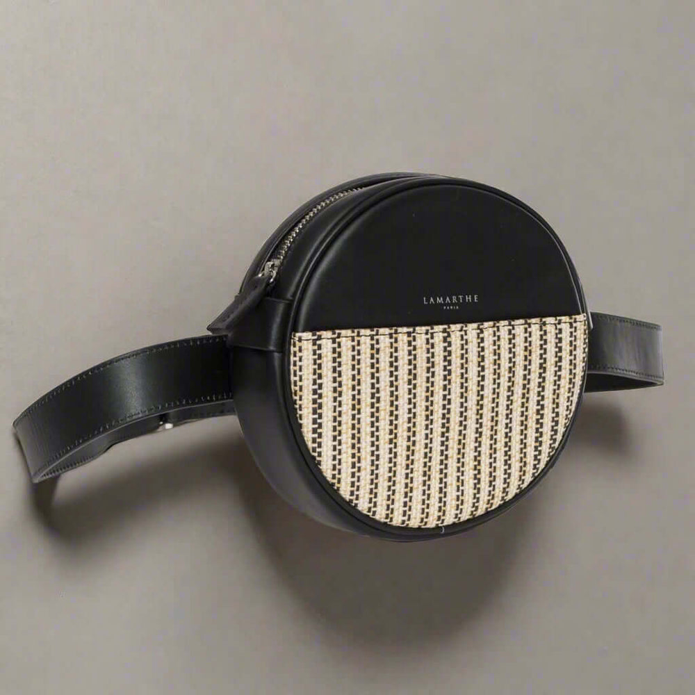 Round black and beige bag with 'Lamartha' branding on a white background