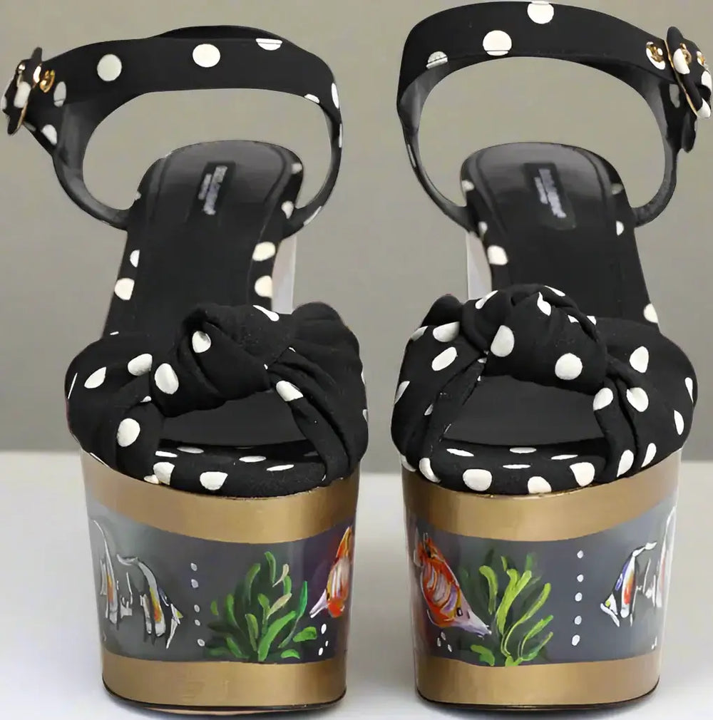 Black polka dot sandals with goldfish design on the sole
