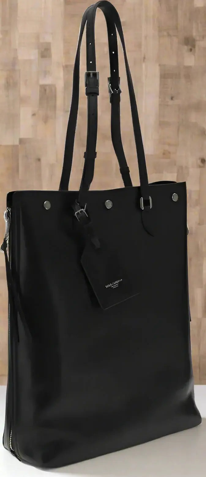 Black tote bag with a visible brand logo on a white background