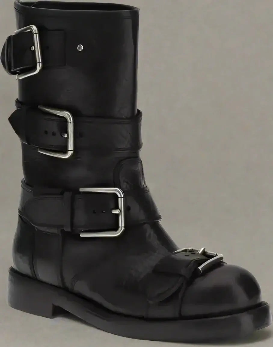 Black leather boot with multiple buckles on a white background