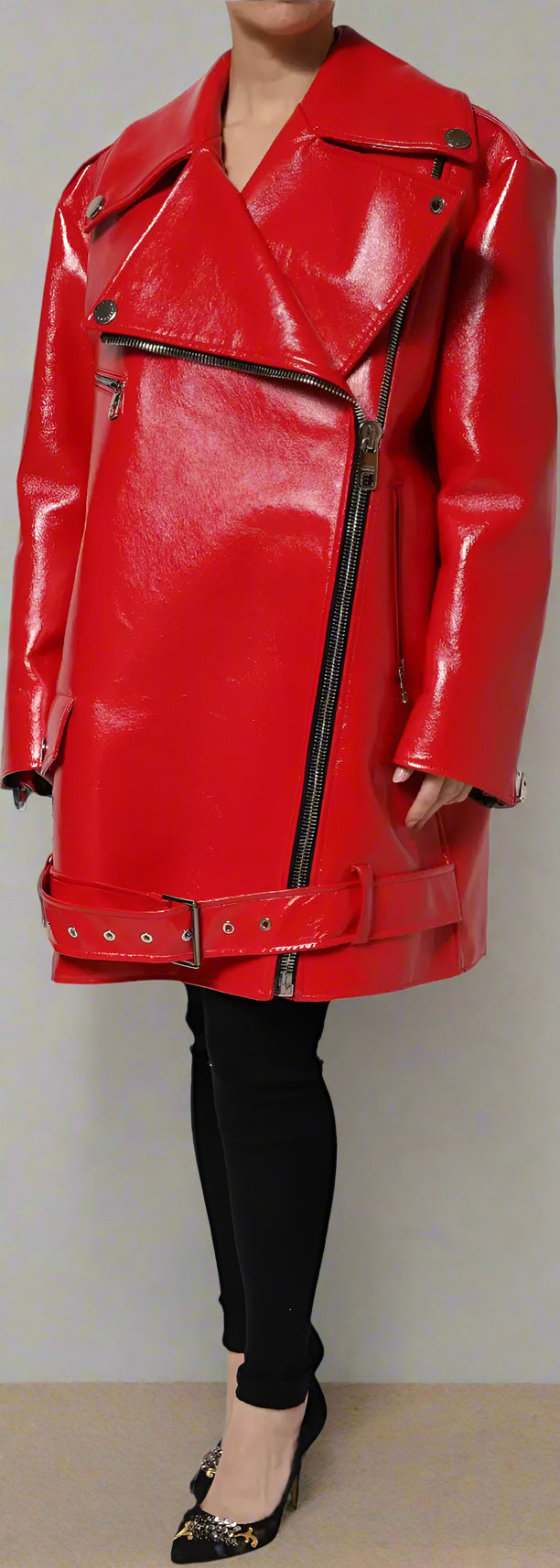 Red leather coat with black zipper details on a white background