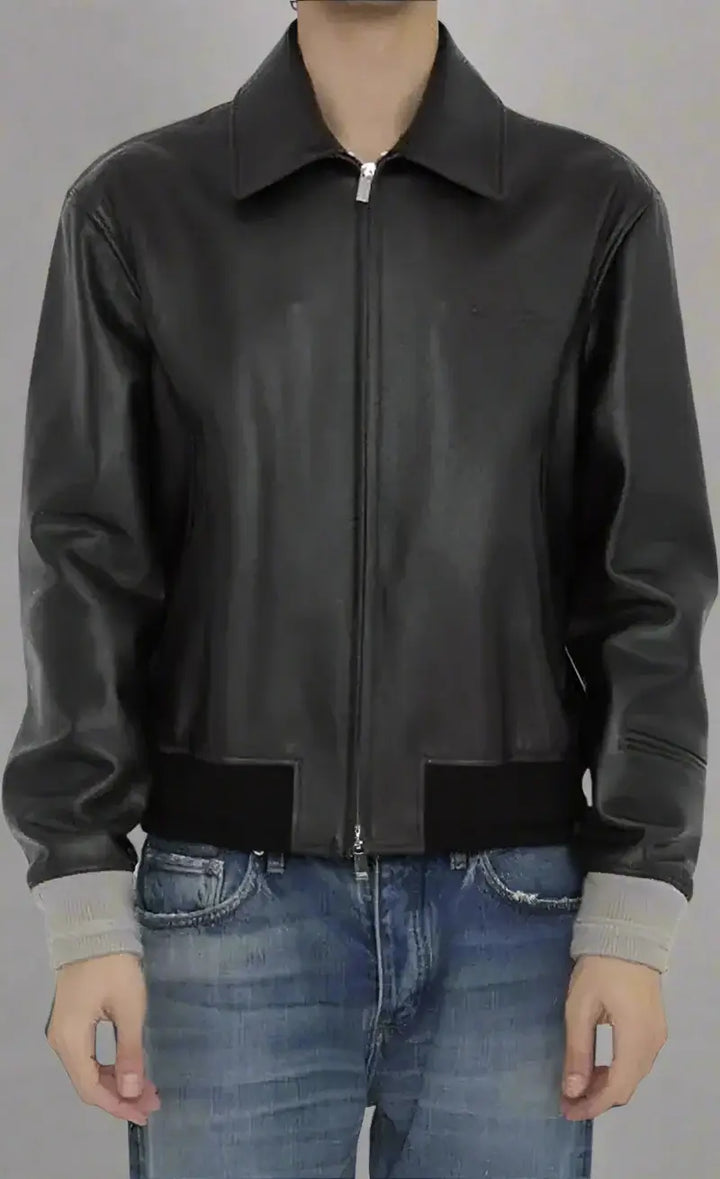 Black leather jacket worn by a person on a white background