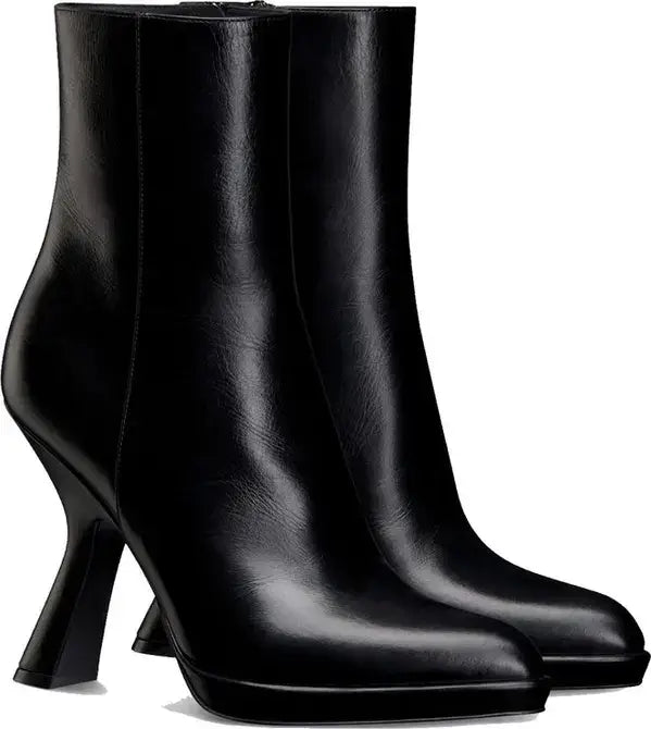 Pair of black high-heeled ankle boots on a white background