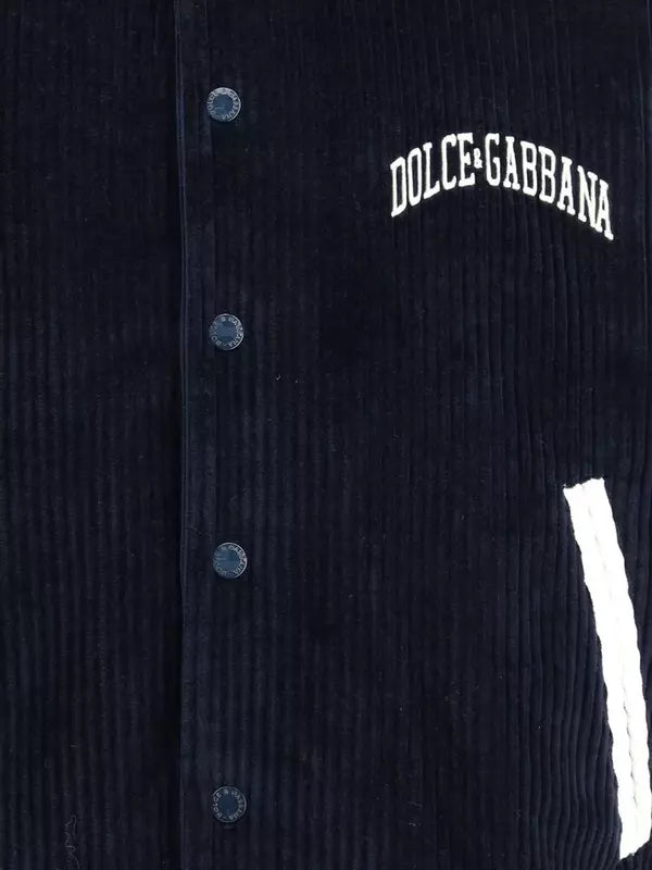 Black corduroy jacket with Dolce & Gabbana logo on a dark background