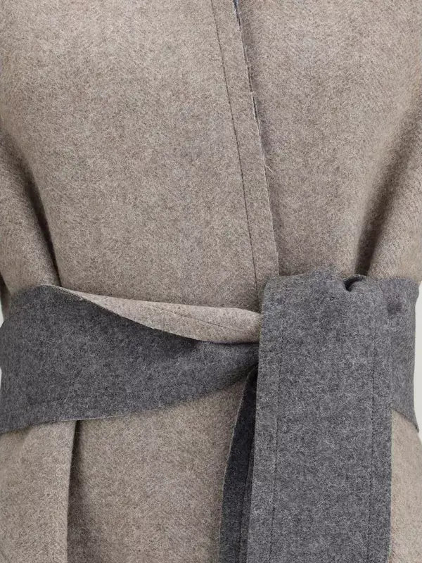 Close-up of a gray coat with a belt