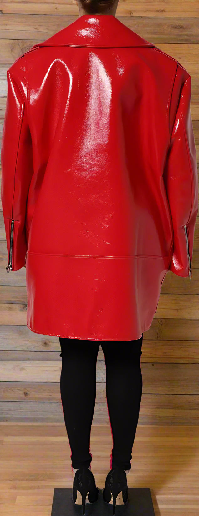 Red leather coat worn by a person on a white background