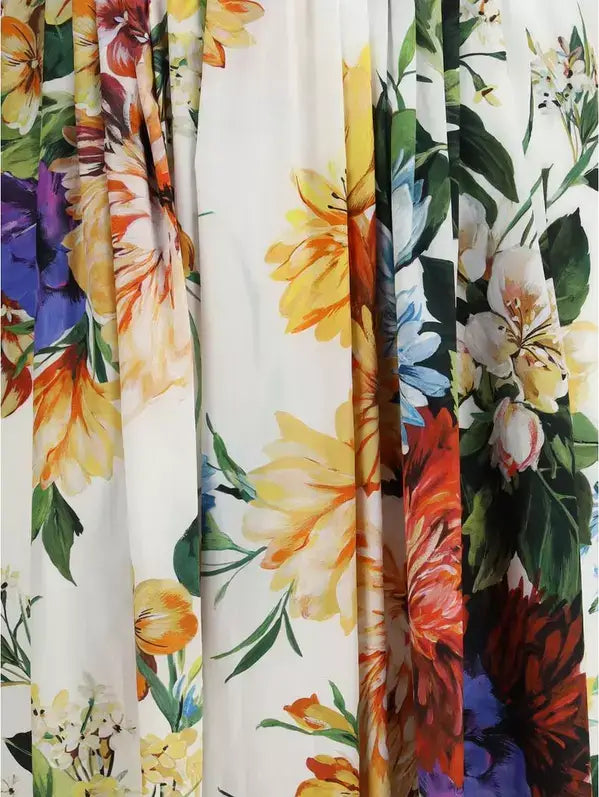 Collection of floral-patterned fabrics in various colors.