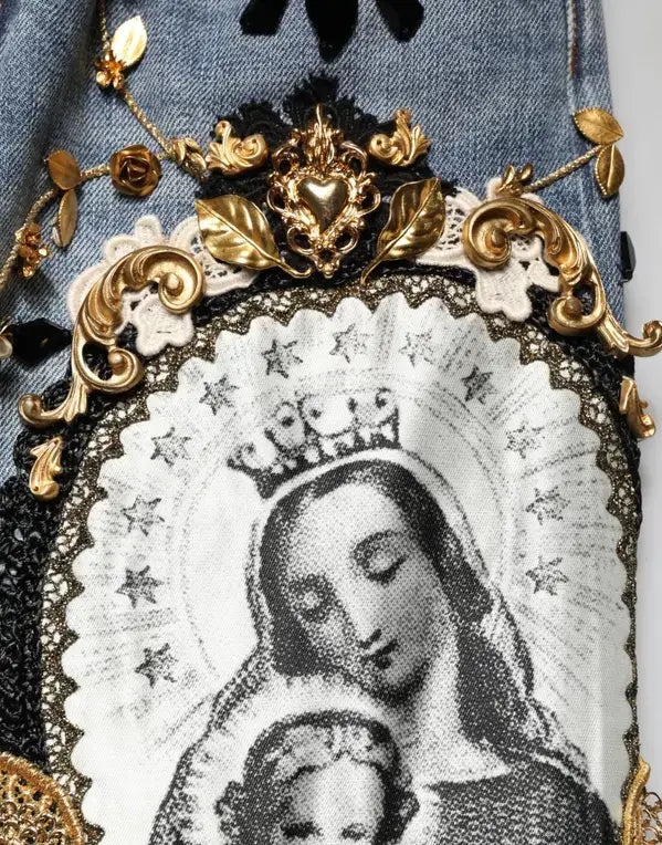 Decorative item with a black and white image of a woman with a child, surrounded by gold embellishments.
