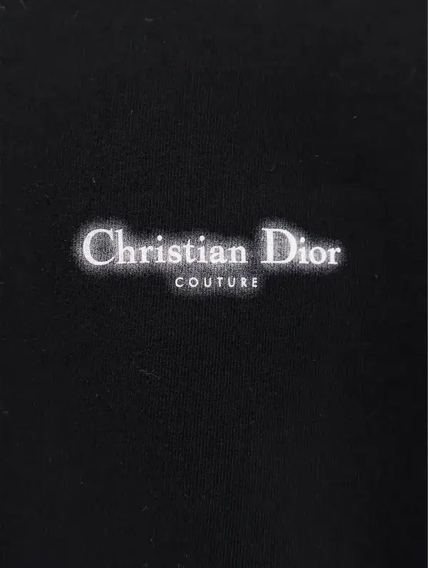 Christian Dior Couture logo on a black background