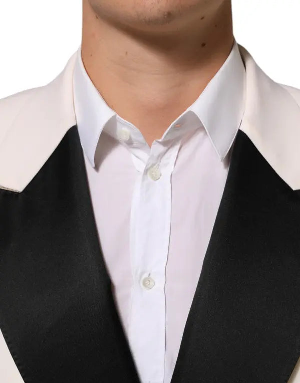 White dress shirt with black vest on a white background