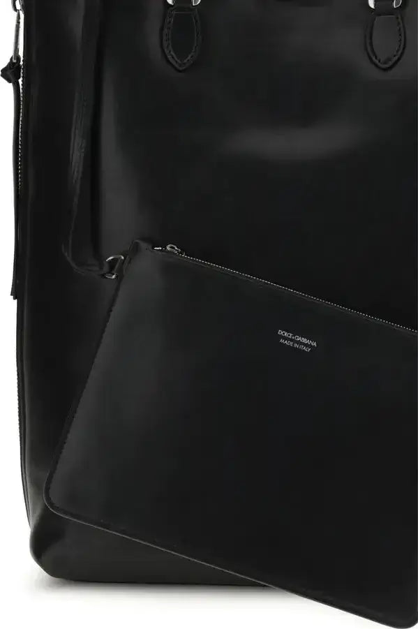 Black backpack with a visible brand logo on a white background