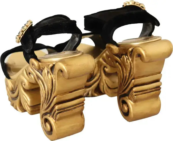 Gold cymbals with black straps on a white background