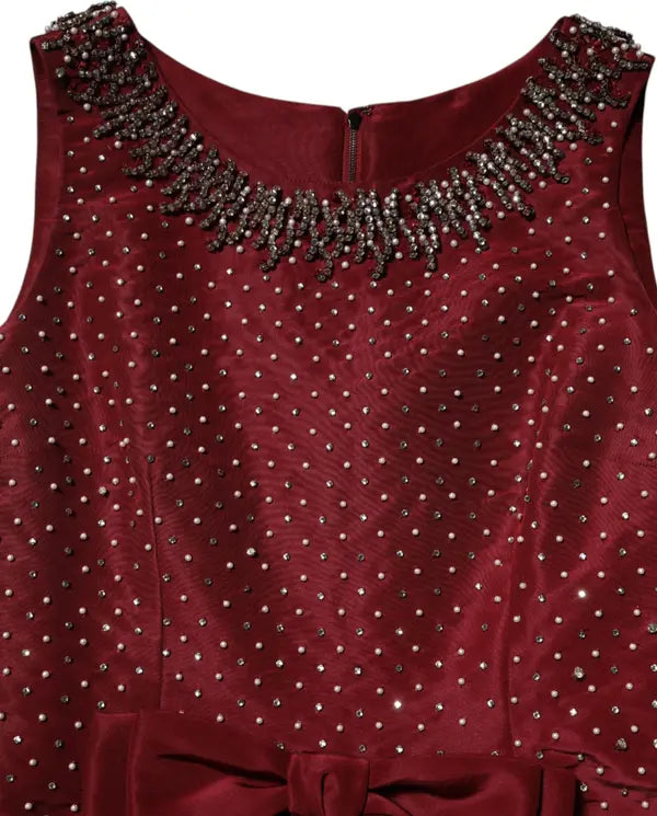 Maroon top with bead embellishments on neckline and shoulders
