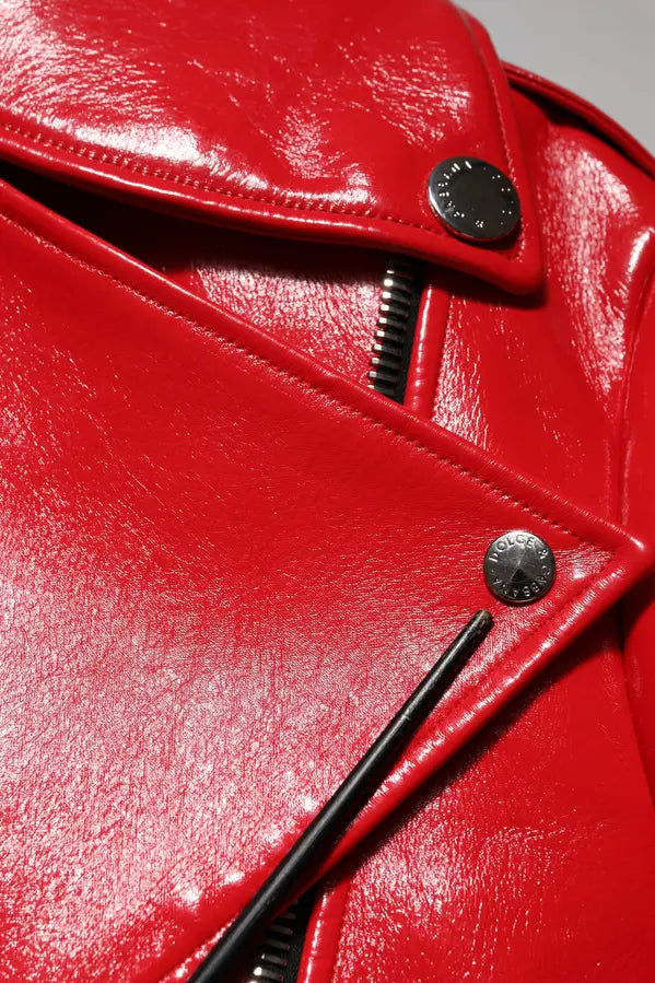 Close-up of a red leather jacket with a zipper