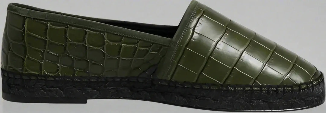 Green slip-on shoe with textured surface on a white background