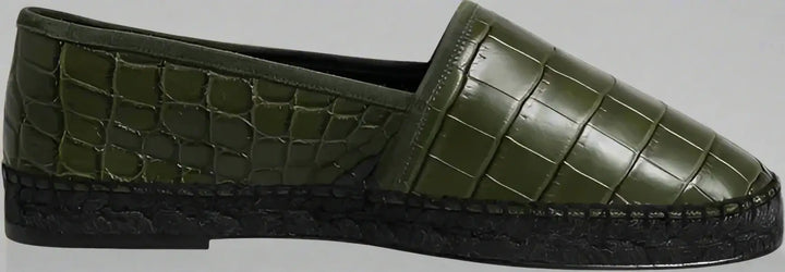 Green slip-on shoe with textured surface on a white background