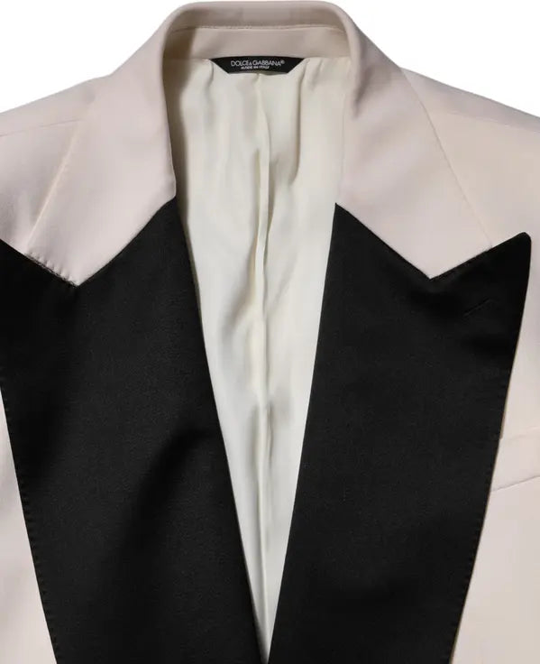 Close-up of a black and white tuxedo jacket with a brand label.