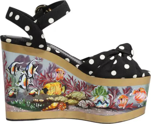 Black polka dot wedge sandal with a colorful underwater scene design on the sole.