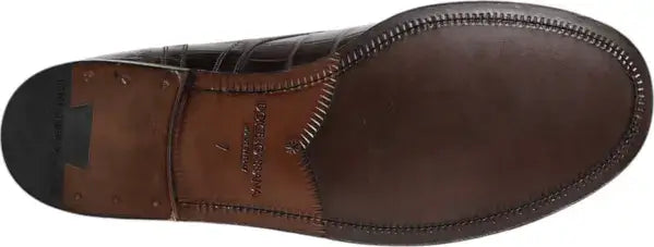 Brown leather shoe with a visible brand logo on the sole