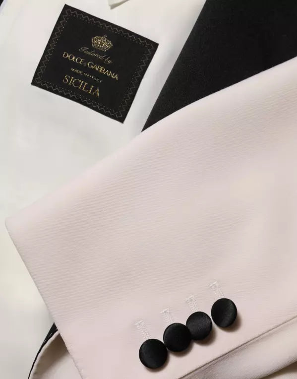 Close-up of a Dolce & Gabbana branded garment with black buttons.