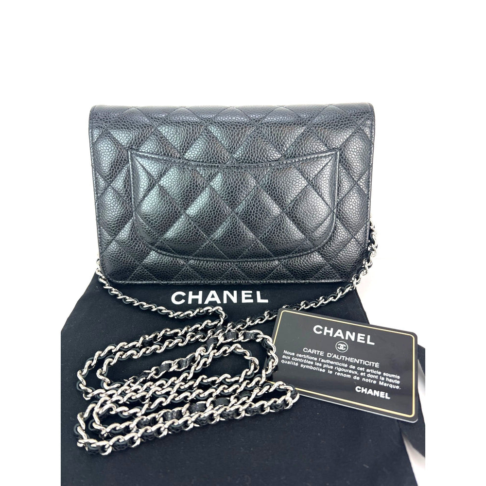Chanel Quilted Caviar Calfskin Wallet on a Chain Clutch displayed with authenticity card and logo, luxury bags.