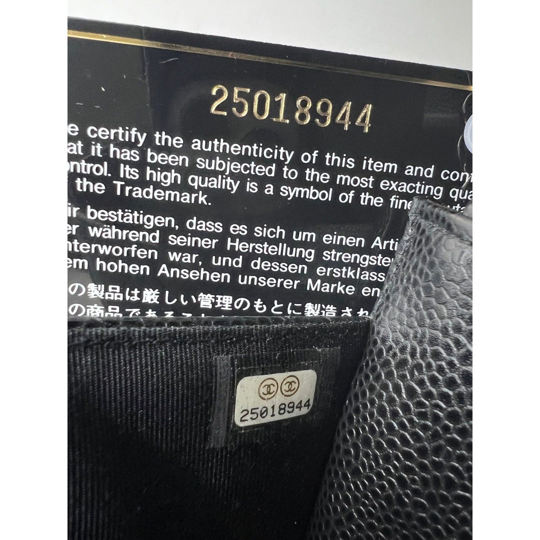Chanel Quilted Caviar Calfskin Wallet on a Chain Clutch authenticity code 25018944 on black leather interior.