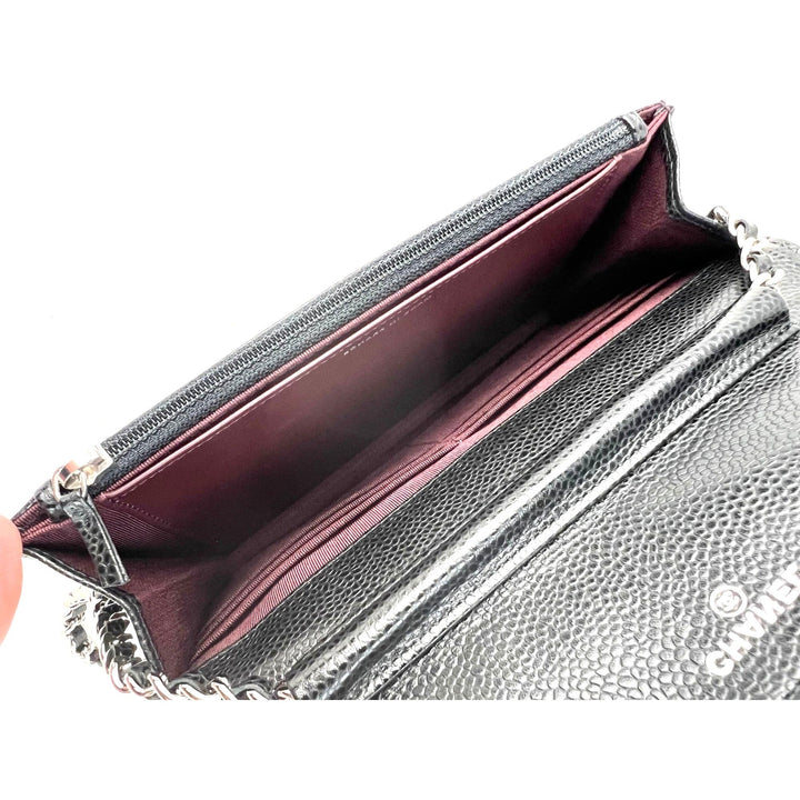 Inside view of the Chanel Quilted Caviar Calfskin Wallet on a Chain Clutch showcasing the burgundy fabric interior.