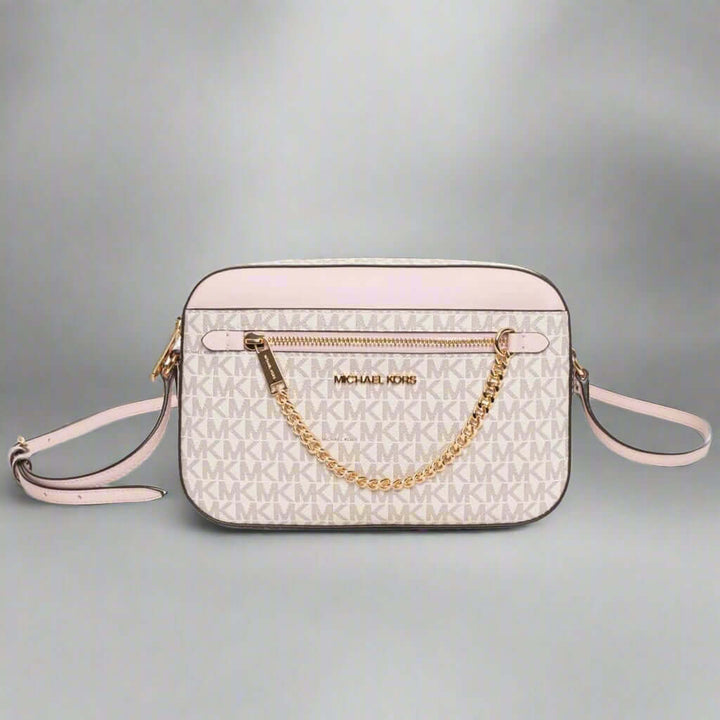 Designer handbag with gold chain detail on a white background