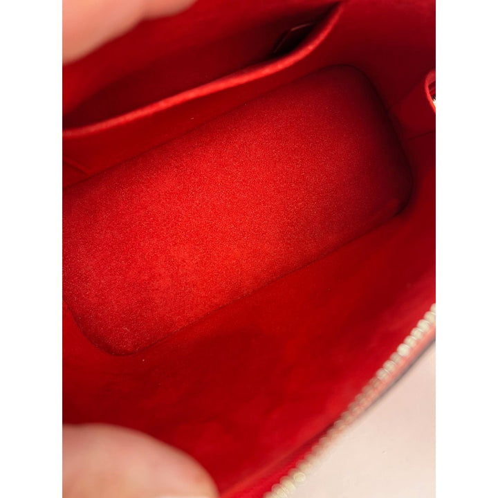 Close-up of a red fabric surface with a textured pattern