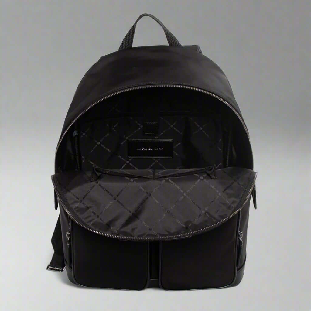 Black backpack with open front compartment on a white background