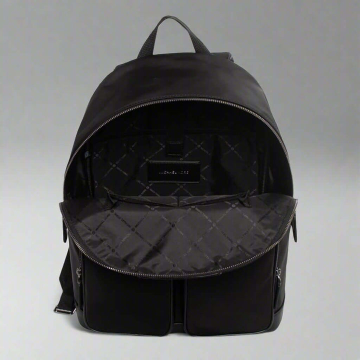 Black backpack with open front compartment on a white background