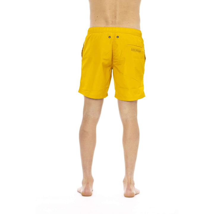 Men’s Bikkembergs beachwear and swimwear collection at STORE 7994 featuring modern swim trunks and sporty beach styles for summer.