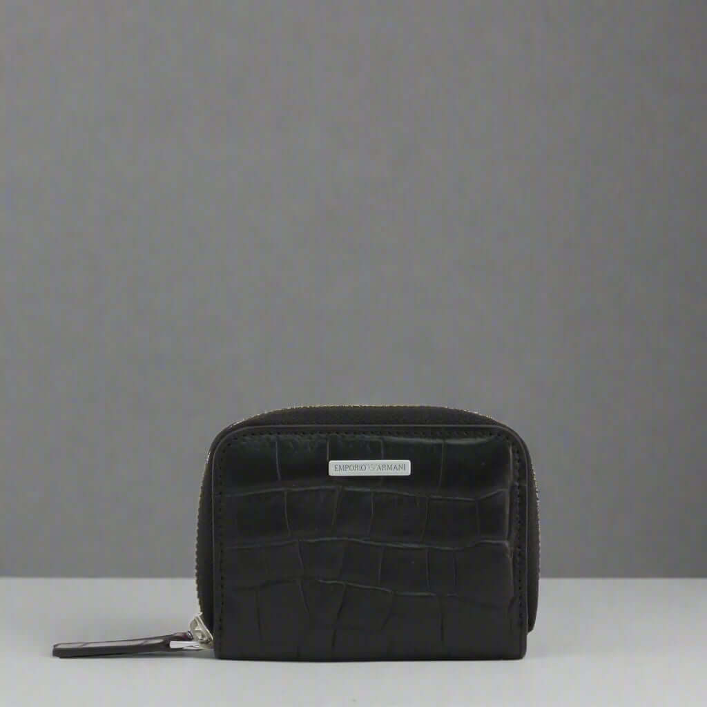 Black crocodile-patterned wallet on a white background