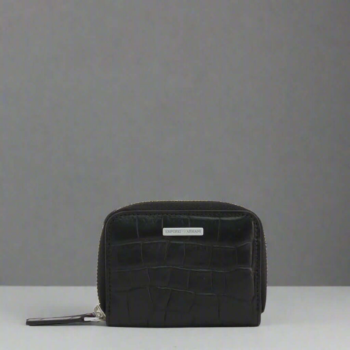 Black crocodile-patterned wallet on a white background