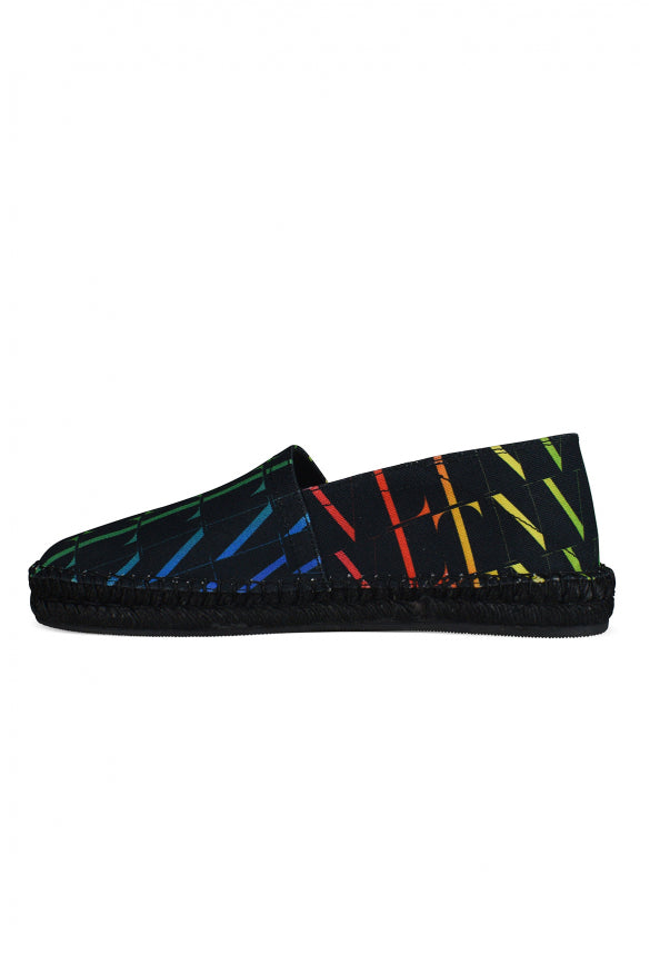 Pair of colorful shoes with black sole on a white background