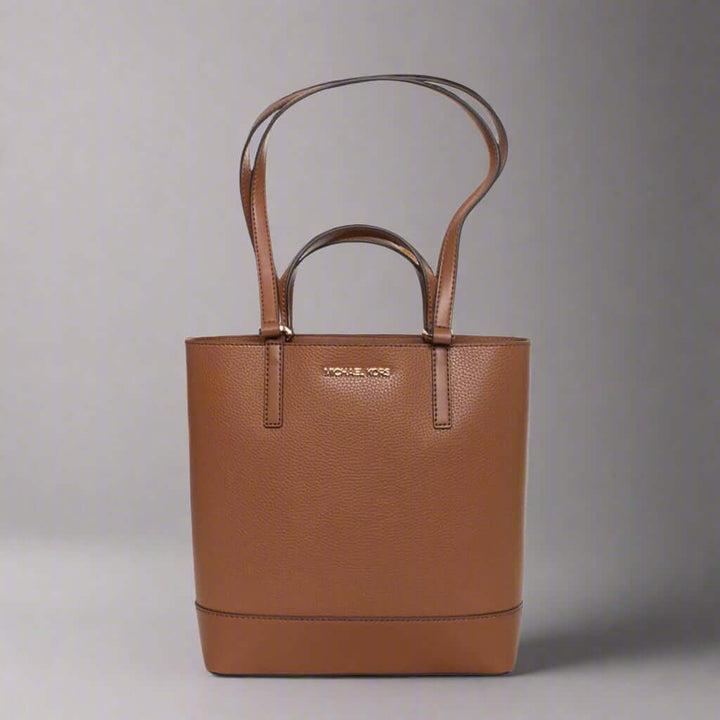 Brown handbag with 'Michael Kors' logo on a white background