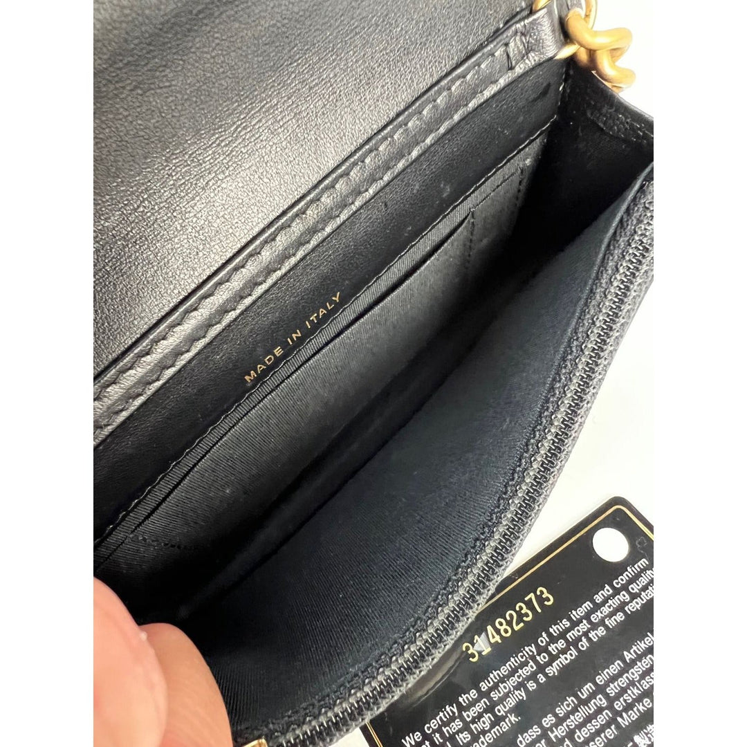 Interior view of Chanel Caviar Quilted Mini Boy Clutch Wallet on a Chain Black showing 'Made in Italy' inscription.