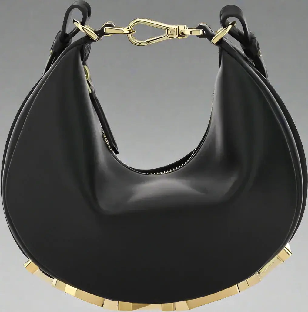 Black handbag with gold accents on a white background