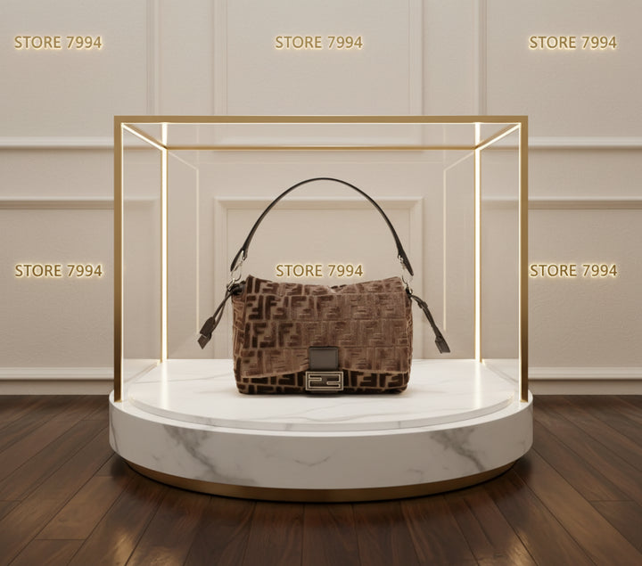 Brown patterned handbag with a visible brand logo on a white background