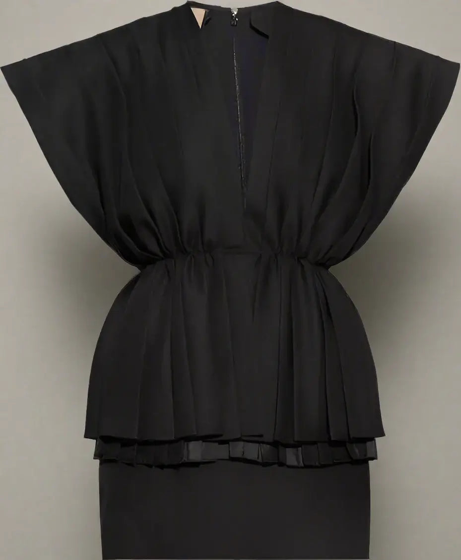 Black peplum top on a white background