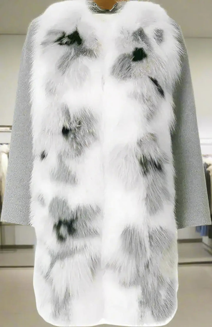 Gray cape with white fur trim on a plain background